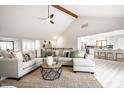 Open-concept living room with a view of the kitchen and dining area at 7665 Stones River Ct, Indianapolis, IN 46259