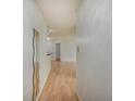 A bright hallway featuring wood floors and a neutral color scheme creating a welcoming and modern atmosphere at 1098 Timber Creek Dr # 2, Carmel, IN 46032