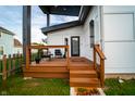 Inviting front porch with stylish seating, wood railing, and modern design at 1112 Spann Ave, Indianapolis, IN 46203