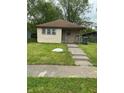 Charming single-story home with a well-maintained lawn and inviting walkway at 2621 N Tacoma Ave, Indianapolis, IN 46218