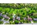 A captivating aerial view of homes with lush greenery and private pools in a tranquil neighborhood at 265 Monticello Dr, Greenwood, IN 46142