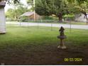 Grassy backyard featuring well-maintained landscaping and an ornamental bird bath at 3057 S Rybolt Ave, Indianapolis, IN 46241