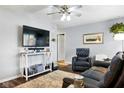 Comfortable living room featuring modern furniture, a large TV, and neutral decor at 349 Clark Ave, Beech Grove, IN 46107