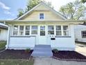 Image of home's front porch, a quaint entrance with new landscaping and fresh exterior paint at 417 S Oakland Ave, Indianapolis, IN 46201