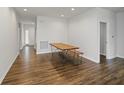 Dining area features wood floors and natural light at 4324 Homestead Dr, Whitestown, IN 46075