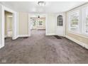 Spacious living room featuring plush carpet with easy access to other rooms at 510 E 23Rd St, Anderson, IN 46016