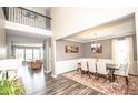 Formal dining room with wood floors, elegant table setting, and neutral wall color at 6064 Bartley Dr, Noblesville, IN 46062