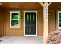 Close-up of the front door and covered porch, with house number displayed at 6938 Rio Grande Dr, Indianapolis, IN 46217