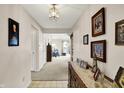 Entryway featuring neutral walls, decorative accents, and a glimpse into the inviting living area, stylish and bright at 7702 Justin Ln, Indianapolis, IN 46219
