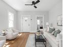 Bright living room features hardwood floors, neutral decor, and modern furnishings for comfortable and stylish living at 809 N Temple Ave, Indianapolis, IN 46201
