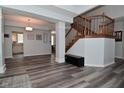 Open concept space with staircase and view of kitchen and dining area at 8627 Lansdowne Dr, Fishers, IN 46038