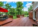 Large backyard deck perfect for entertaining, with built-in seating and dining area at 9036 Buckeye Ct, Indianapolis, IN 46260