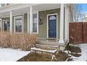 Inviting porch features classic columns and a well-kept exterior, ideal for relaxing at 923 S State Ave, Indianapolis, IN 46203