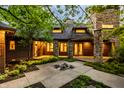Inviting patio area with stone accents and well-manicured landscaping, perfect for outdoor entertaining at 9387 Sullivan Pl, Zionsville, IN 46077
