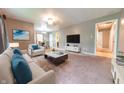Spacious living room with neutral paint, plush carpet, and comfortable seating arrangement at 980 Red Maple Ct, Greenwood, IN 46143