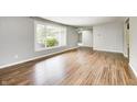 Inviting living room features hardwood floors and a large window at 101 N Westbury Rd, Pendleton, IN 46064