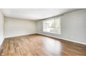Bright living room with hardwood floors and large window offering ample natural light at 101 N Westbury Rd, Pendleton, IN 46064