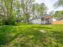 Spacious backyard with lush green lawn, perfect for outdoor activities at 1132 Sharon Ave, Indianapolis, IN 46222