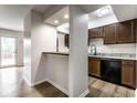 An open concept kitchen and dinning area with stainless steel appliances and lots of natural light at 1142 Canterbury S Sq # B, Indianapolis, IN 46260