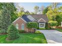 Charming brick home with manicured lawn and mature landscaping, offering great curb appeal at 12065 Gray Eagle Dr, Fishers, IN 46037