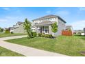 Charming two-story home with stone accents, well-maintained lawn, and a neatly paved driveway at 1289 Sunset Blvd, Avon, IN 46123
