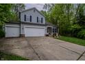 Charming two-story home with a two car garage, brick accents, and long driveway at 1334 Legacy Ct, Indianapolis, IN 46234