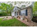 Charming home with brick accents, landscaping, and well-manicured lawn at 1334 Legacy Ct, Indianapolis, IN 46234
