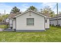 Well-maintained single-story home with white siding and a cozy, welcoming appearance at 1391 N Shadeland Ave, Indianapolis, IN 46219