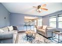 Comfortable living room with a ceiling fan, an open bar, and a cozy atmosphere at 1404 Norton Dr, Greenwood, IN 46143