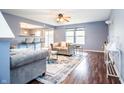 Spacious living room with hardwood floors, modern furnishings, and abundant natural light at 1404 Norton Dr, Greenwood, IN 46143