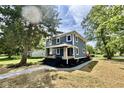 Charming blue two-story home with a welcoming front porch and landscaped yard at 1601 E Edwards Ave, Indianapolis, IN 46227