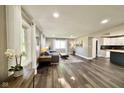 Open-concept living room with dark wood floors, ample natural light, and stylish decor at 1601 E Edwards Ave, Indianapolis, IN 46227