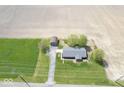 Stunning aerial view of the charming home, showing surrounding greenery and the outbuilding at 1737 W 1000 N, Alexandria, IN 46001