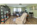 Inviting living room featuring a large sectional sofa and hardwood flooring at 2237 W 100 N, Greenfield, IN 46140