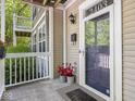 Close-up of the front door, showcasing the house number, stylish fixtures, and a welcoming entrance at 2403 N Delaware St, Indianapolis, IN 46205