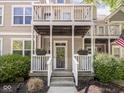 Inviting front porch with flower boxes and a clear view of the house number, 2403 at 2403 N Delaware St, Indianapolis, IN 46205
