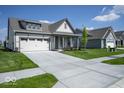 Attractive home with a manicured lawn, two car garage, and concrete driveway at 345 Ehrlich Ln, Westfield, IN 46074