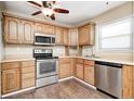 Functional kitchen featuring stainless steel appliances, light wood cabinets and a stainless steel sink at 423 W Janet Dr, Brownsburg, IN 46112