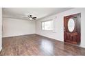 Inviting living room with beautiful flooring, a ceiling fan and ample natural light at 423 W Janet Dr, Brownsburg, IN 46112
