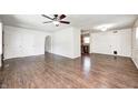 Spacious living room featuring stylish flooring, neutral paint and direct access to kitchen at 423 W Janet Dr, Brownsburg, IN 46112