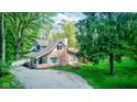 Aerial view of the house on a large lot with mature trees at 5811 King Ave, Indianapolis, IN 46228