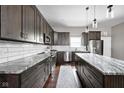 Modern kitchen featuring sleek countertops, stainless steel appliances, and ample cabinetry for storage at 863 N Park Trail Dr, Carmel, IN 46032