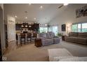 Cozy living room open to kitchen featuring plush sofas, high ceilings and plenty of natural light at 934 Steel Horse Dr, Westfield, IN 46074