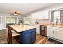 Bright kitchen with a large island, stainless steel appliances, modern countertops, and tile flooring at 941 W Barouche, Pendleton, IN 46064