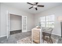 Bright office space featuring carpet, ample natural light, and French doors for added privacy at 991 Terra Ln, Franklin, IN 46131