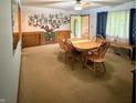 Traditional dining room featuring wooden furniture, neutral walls, and carpet at 10946 Maze Rd, Indianapolis, IN 46259