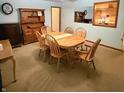 Traditional dining room featuring wooden furniture, neutral walls, and built-in hutch at 10946 Maze Rd, Indianapolis, IN 46259