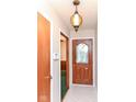 Inviting entryway with decorative front door and stylish light fixture at 11603 Peacock Dr, Indianapolis, IN 46236