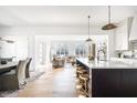 Bright kitchen with a large island, marble countertops, and an open concept layout at 11904 Spring Mill Rd, Carmel, IN 46032