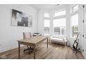 Bright and airy office space with large windows, wood floors, and stylish decor at 127 Monon Green Blvd, Carmel, IN 46032